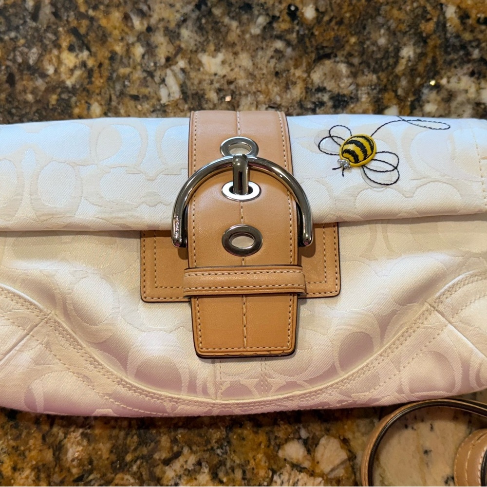 Sold Elsewhere. Coach Signature Optic White and Tan SoHo Clutch with Bumble Bee